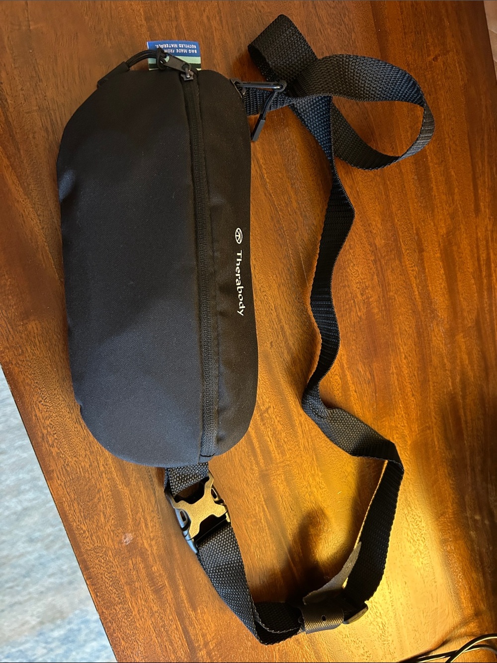 Therabody Black Crossbody Sling Bag. United Airlines.